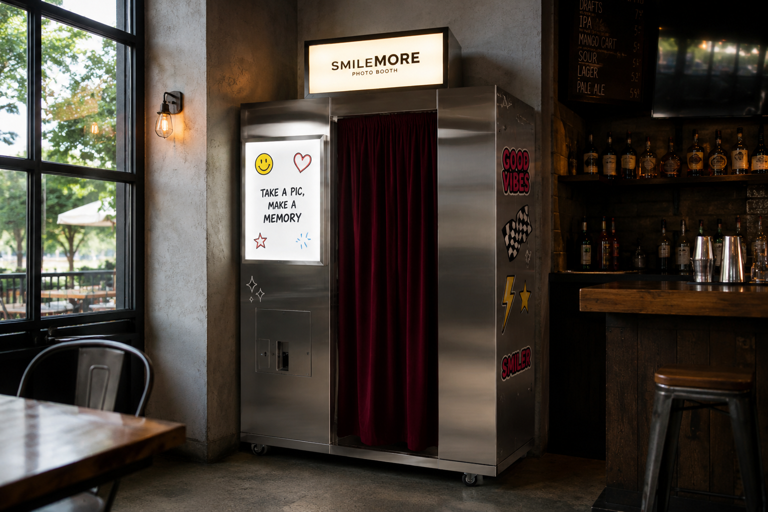 Stainless steel SmileMore photo booth with red curtain installed inside a South Florida bar